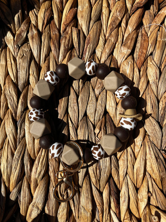 Brown cow print wristlet